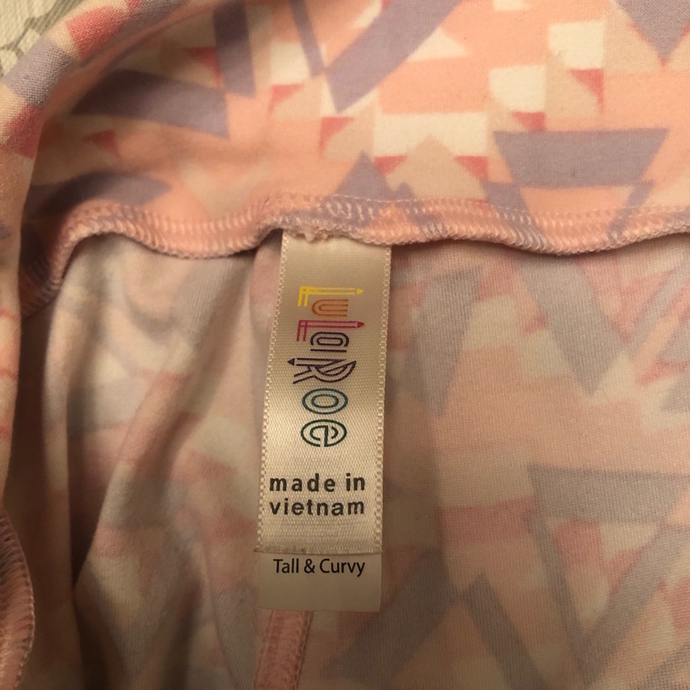 Lularoe “TC” tall and curvy leggings with pink and purple aztec design.